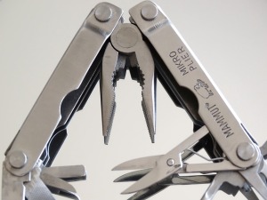 Pocket tool with scissors and pliers